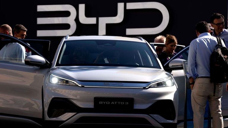 Visitors look at the Chinese made BYD ATTO 3 at...