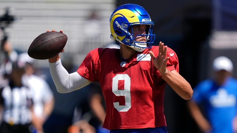 Los Angeles Rams quarterback Matthew Stafford throws during a joint...