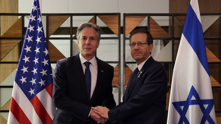 U.S. Secretary of State Blinken, left, meets with Israel's President...