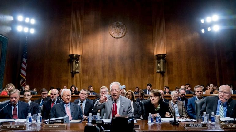 Senate Judiciary Committee chairman Chuck Grassley, center, leads a hearing...