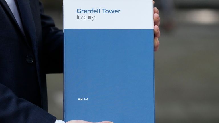 A copy of the Grenfell Tower Inquiry report is shown...