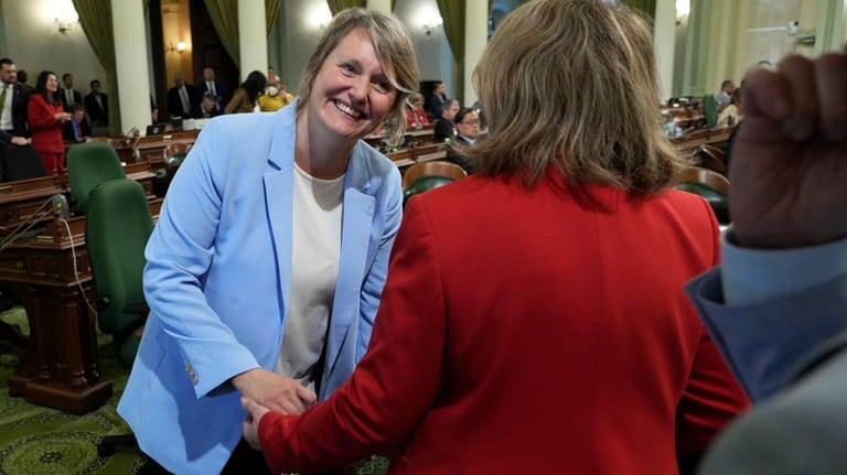 Assemblywoman Buffy Wicks, D-Oakland, left, is congratulated by Assemblywoman Eloise...