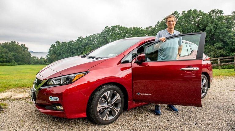 Biology professor Mark Kenny says his 2019 Leaf has made...