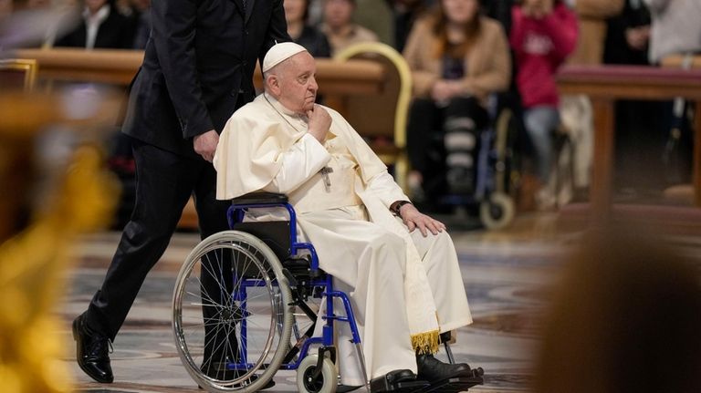 Pope Francis arrives to preside over a Mass in St....