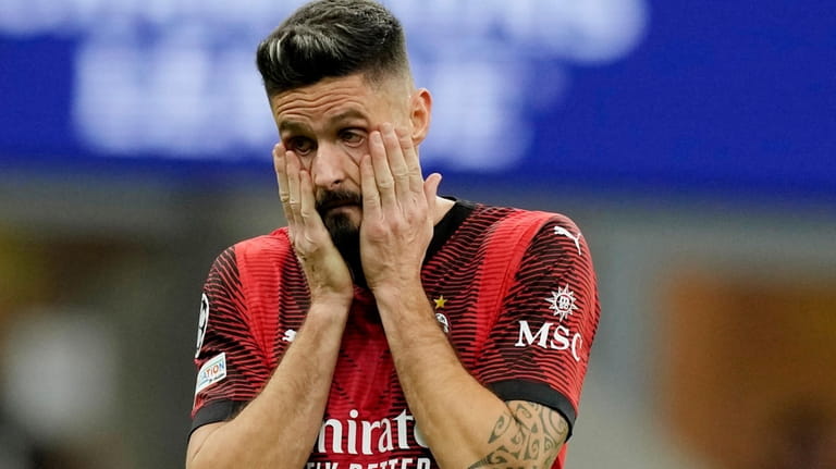 AC Milan's Olivier Giroud gestures during the Champions League group...