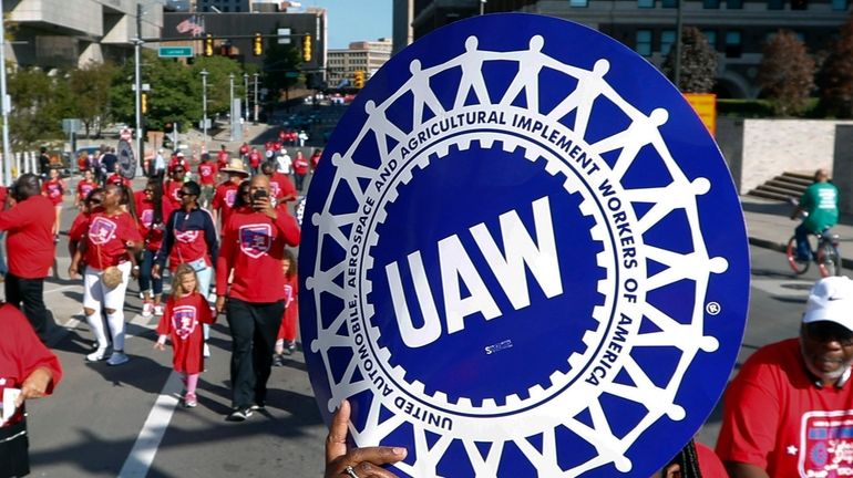 United Auto Workers members walk in the Labor Day parade...