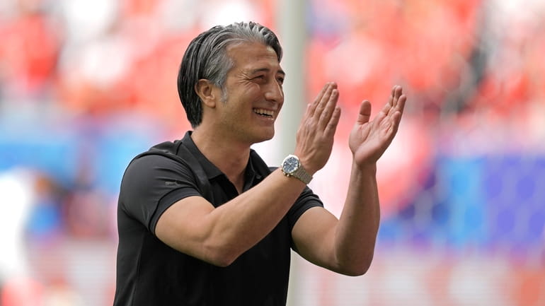 Switzerland's head coach Murat Yakin reacts to the fans before...