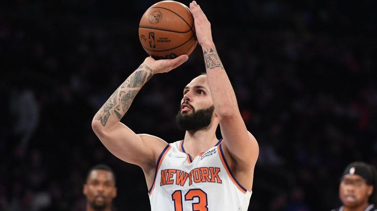 Knicks guard Evan Fournier shoots a technical foul shot against...