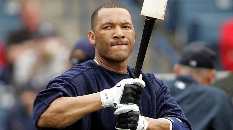 Yankees outfielder Gary Sheffield stands outside the cage during batting practice...