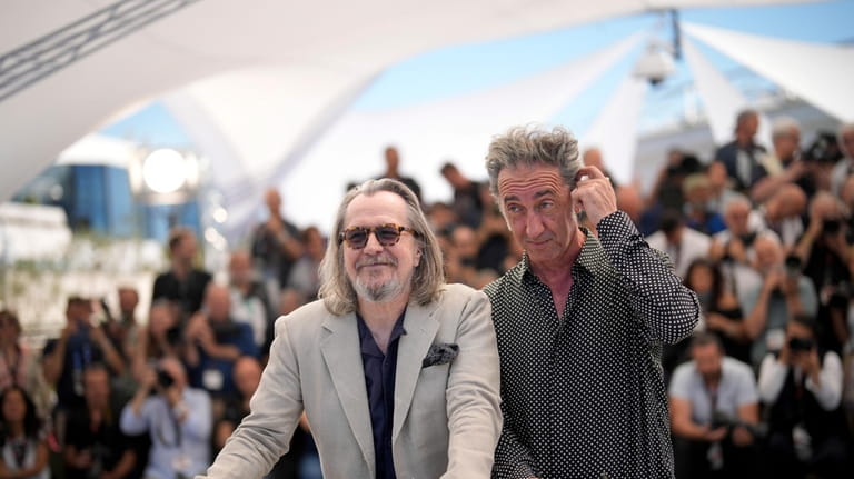 Gary Oldman, left, and director Paolo Sorrentino pose for photographers...