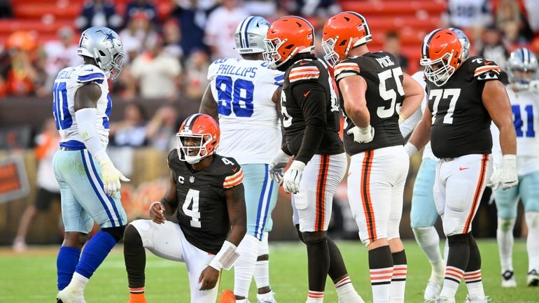 Cleveland Browns' Deshaun Watson (4) recovers after throwing an incomplete...