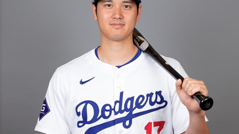 Los Angeles Dodgers designated hitter Shohei Ohtani poses for a...