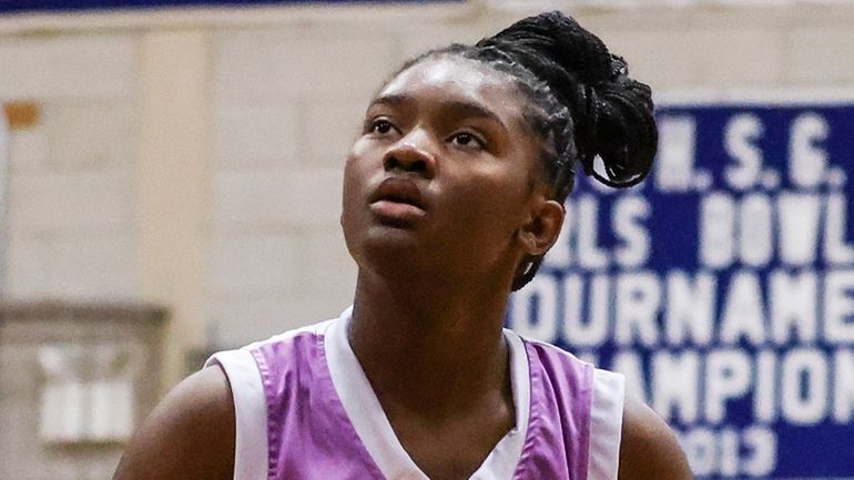 Jasmine McKay of North Babylon concentrates on her free throw...