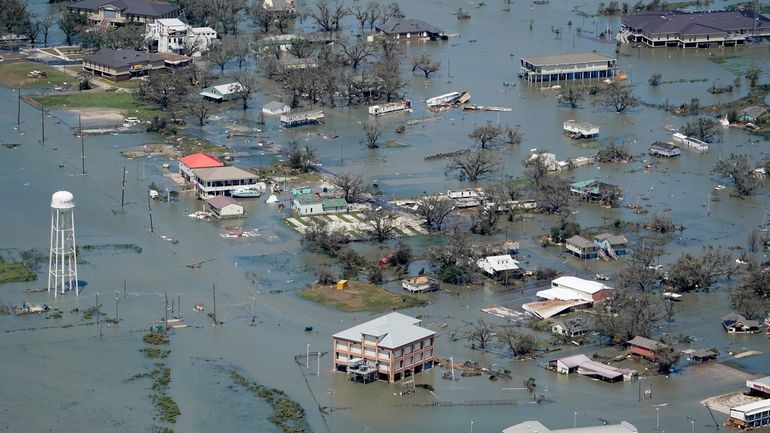 Buildings and homes are flooded in the aftermath of Hurricane...