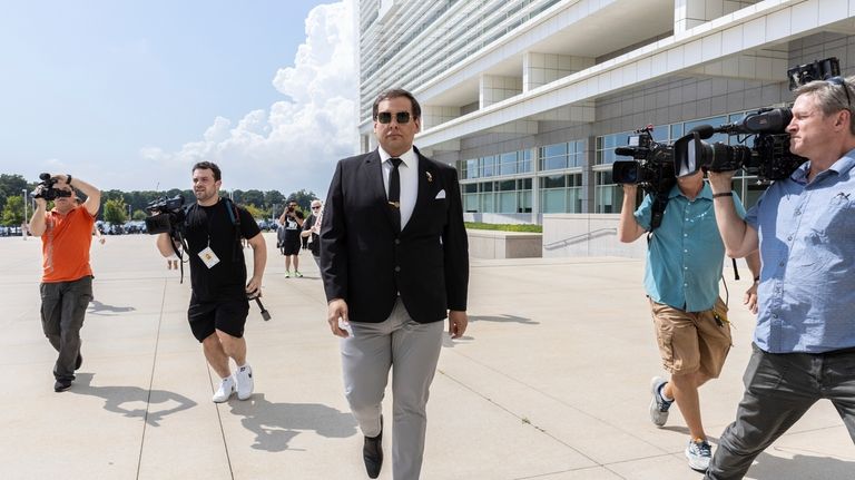 Former U.S. Rep. George Santos arrives at court in Central...