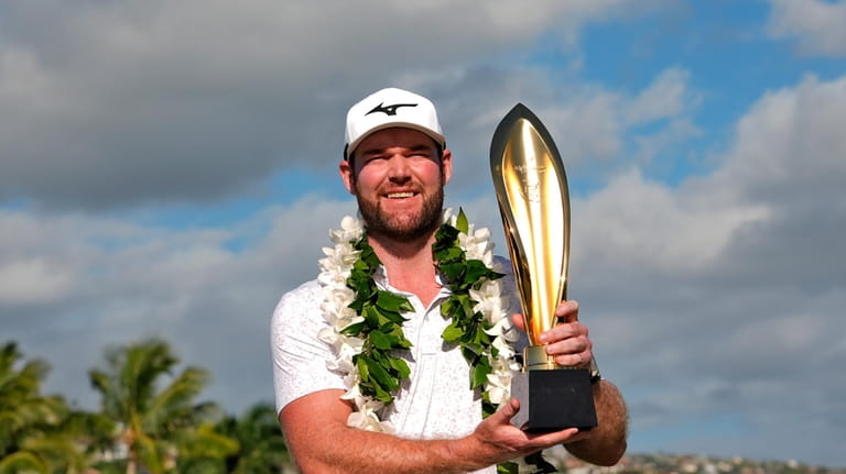 FILE -Grayson Murray holds the trophy after winning the Sony...