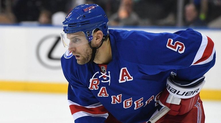 New York Rangers defenseman Dan Girardi sets before a faceoff...