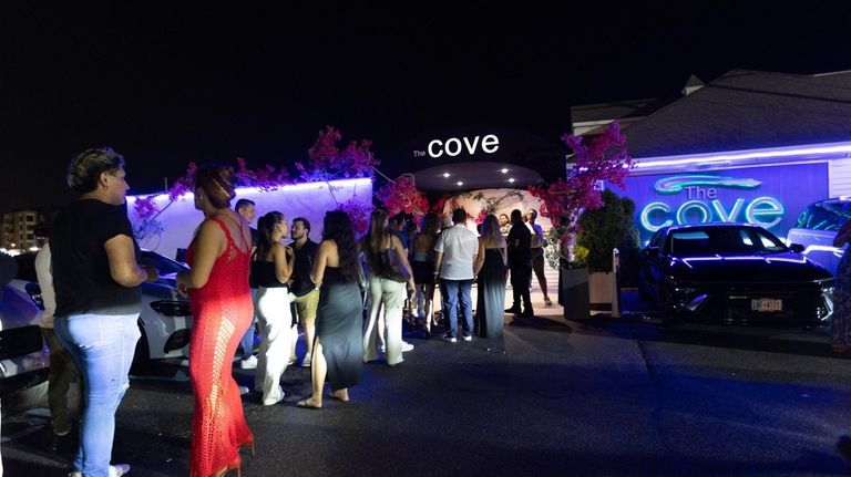 A line grows outside The Cove on a Saturday night in...