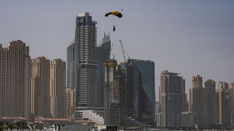 Sky divers glides a parachute as they prepare to land...