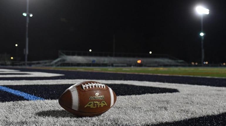 A football sits in the end zone on Tuesday, March...