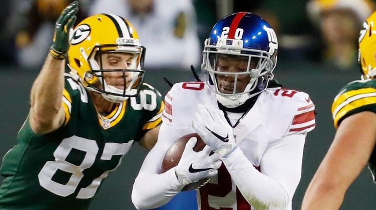 New York Giants' Janoris Jenkins runs back his interception in...