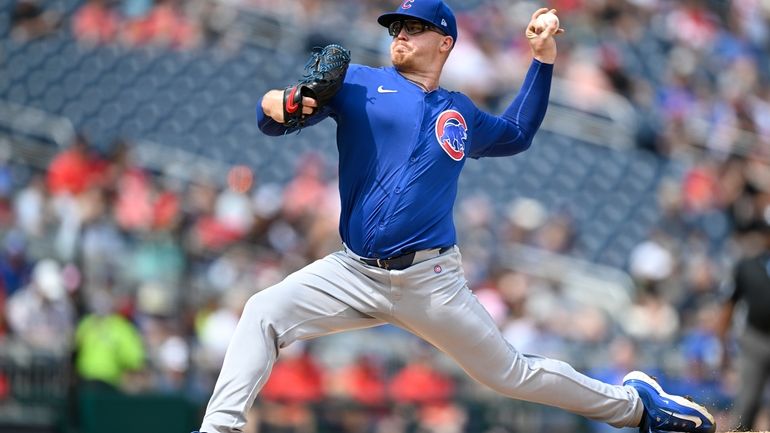 Chicago Cubs starting pitcher Jordan Wicks throws during the first...