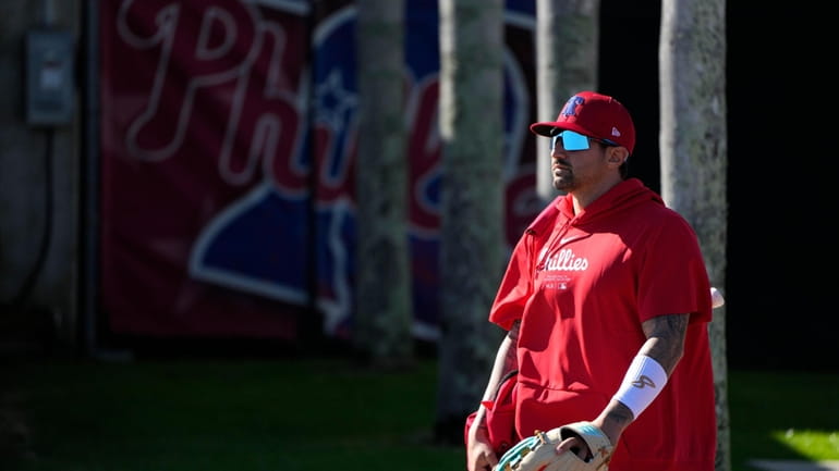 Philadelphia Phillies right fielder Nick Castellanos walks to the field...