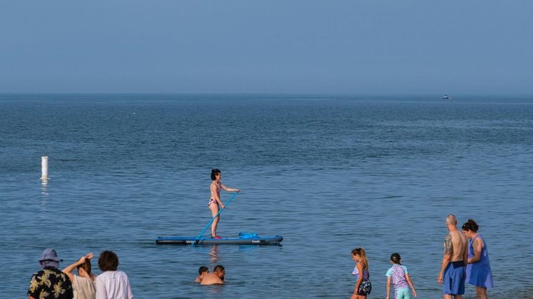 Late afternoon, as most beachgoers leave Cedar Beach in Mount...