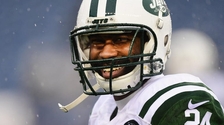 Darrelle Revis #24 of the New York Jets reacts before...