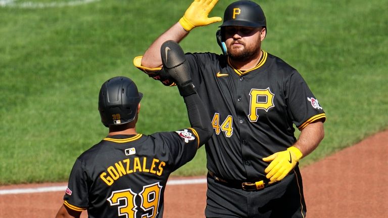 Pittsburgh Pirates' Rowdy Tellez (44) celebrates with Nick Gonzales after...