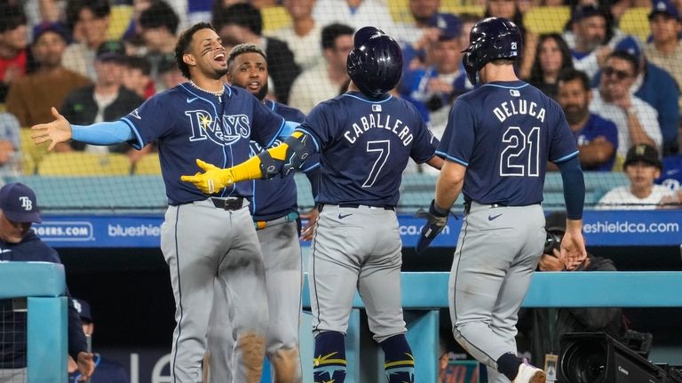 Tampa Bay Rays' José Caballero (7) celebrates after hitting a...