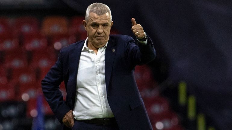 Monterrey's coach Javier Aguirre gives a thumbs-up to his players...