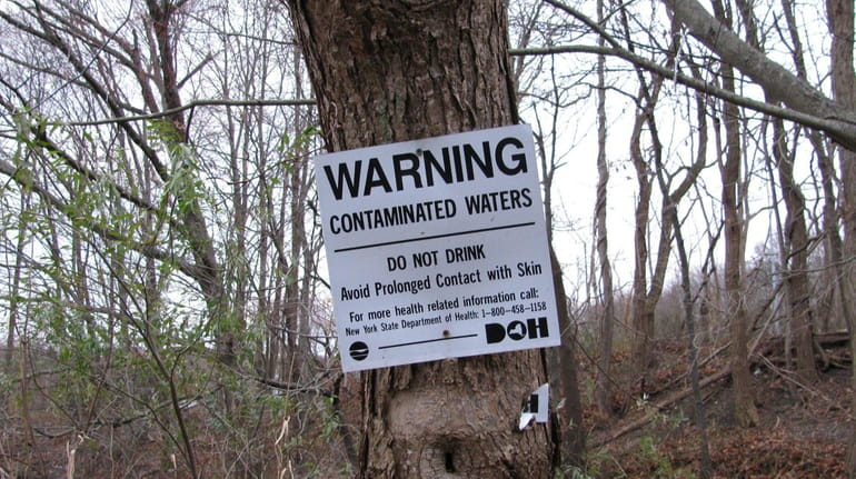 A sign at the Old Mill Creek, which the EPA...