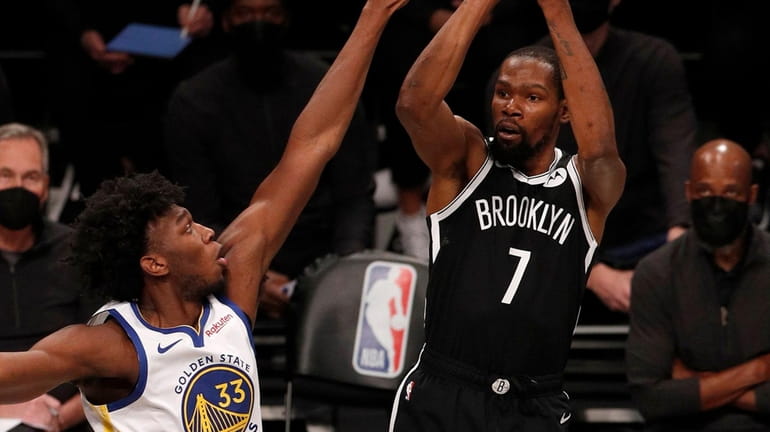 Kevin Durant of the Nets puts up a shot during...