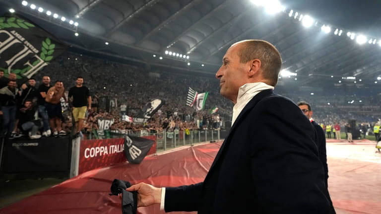 Juventus' head coach Massimiliano Allegri holds his tie at the...