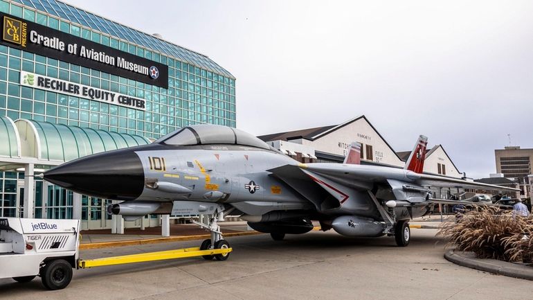 The Cradle of Aviation Museum unveils the restored Navy F-14...