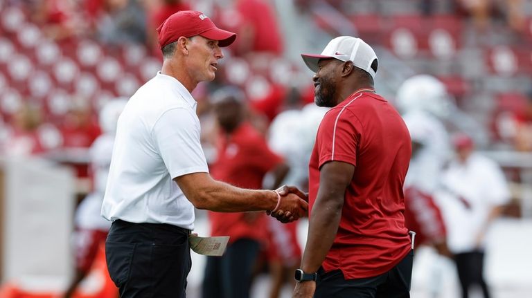 Oklahoma head coach Brent Venables, left, and Temple head coach...