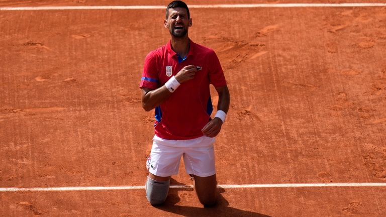 Serbia's Novak Djokovic reacts after defeating Spain's Carlos Alcaraz in...