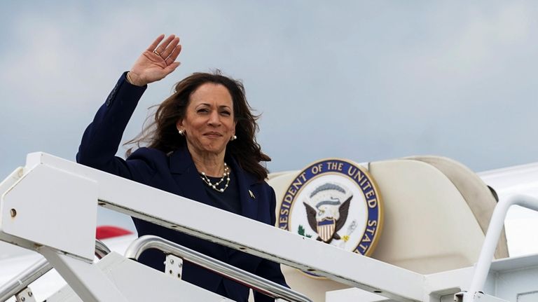 Vice President Kamala Harris waves as she departs Andrews Air...