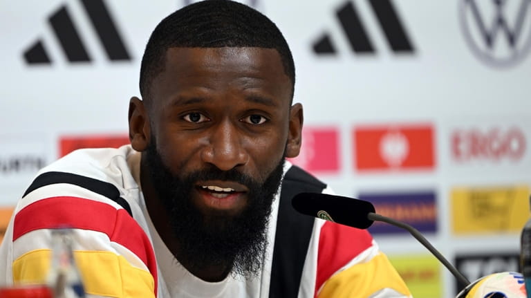 Germany's national soccer team Antonio Rüdiger answers journalists' questions in...