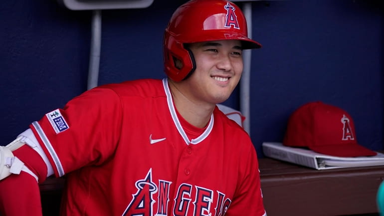 Los Angeles Angels' Shohei Ohtani smiles before a baseball game,...