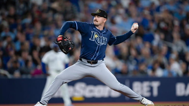 Tampa Bay Rays pitcher Tyler Alexander (14) throws to a...