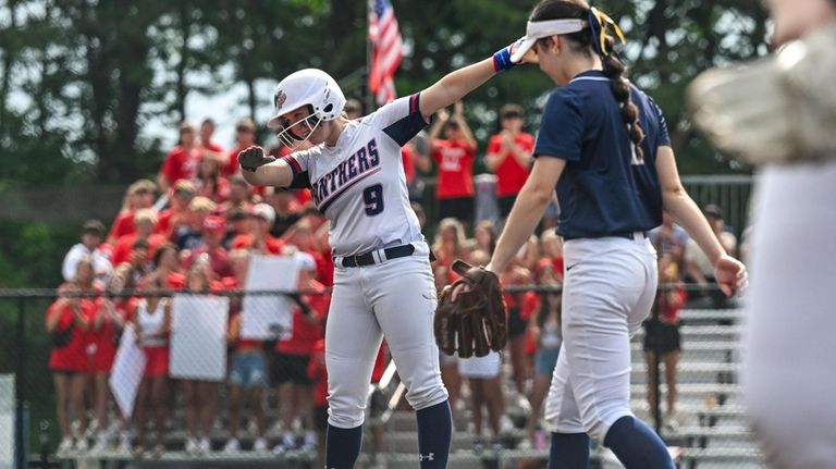 Emily Lopez of Miller Place reacts after hitting a double...