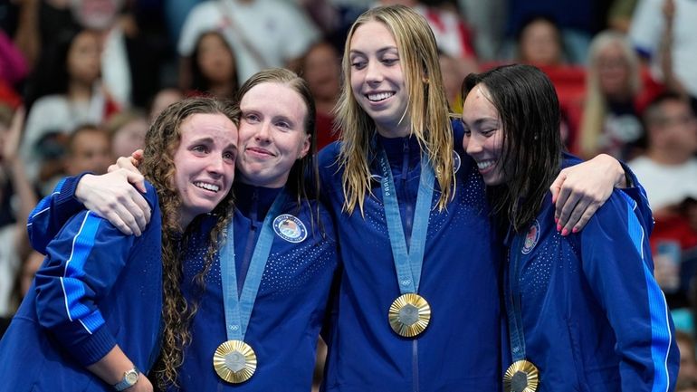 United States' gold medalists Regan Smith, Lilly King, Gretchen Walsh,...