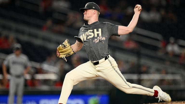 Washington Nationals starting pitcher DJ Herz throws during the fourth...