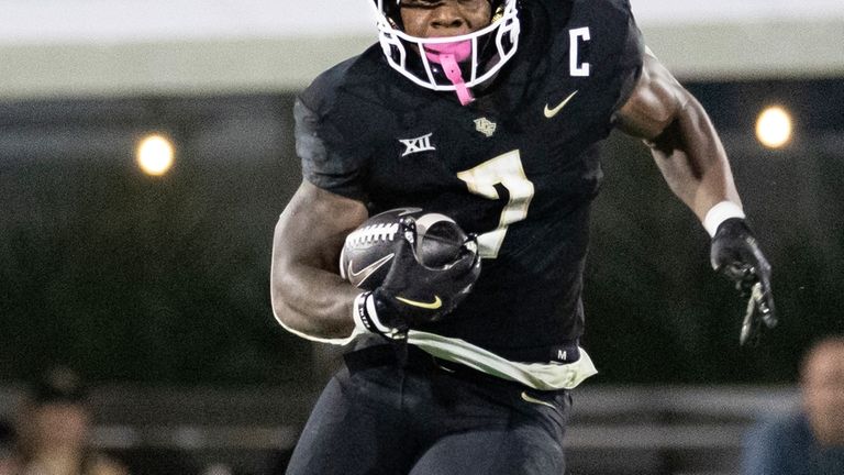 Central Florida running back RJ Harvey (7) runs with the...