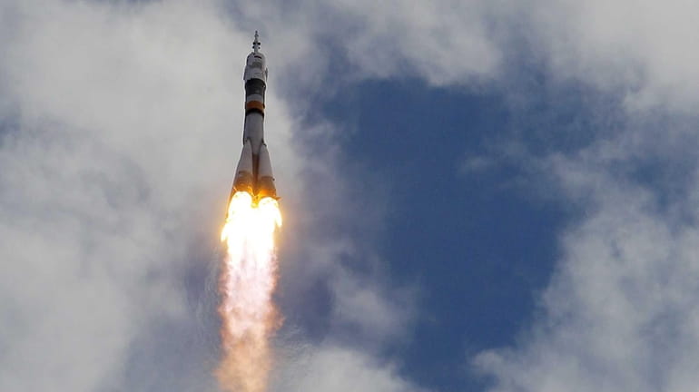 The Soyuz-FG rocket booster with Soyuz TMA-05M space ship carrying...