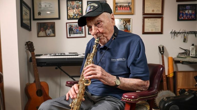 World War II veteran Dominick Critelli, 103, still plays the saxophone with...