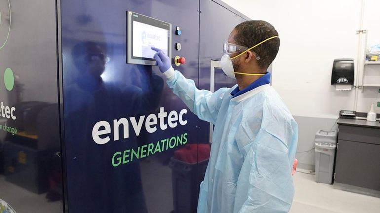 Edgar Rill, a cleaning service employee, demonstrates the "Enventec Generations"...