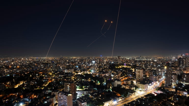 Israeli Iron Dome air defense system fires to intercept a...
